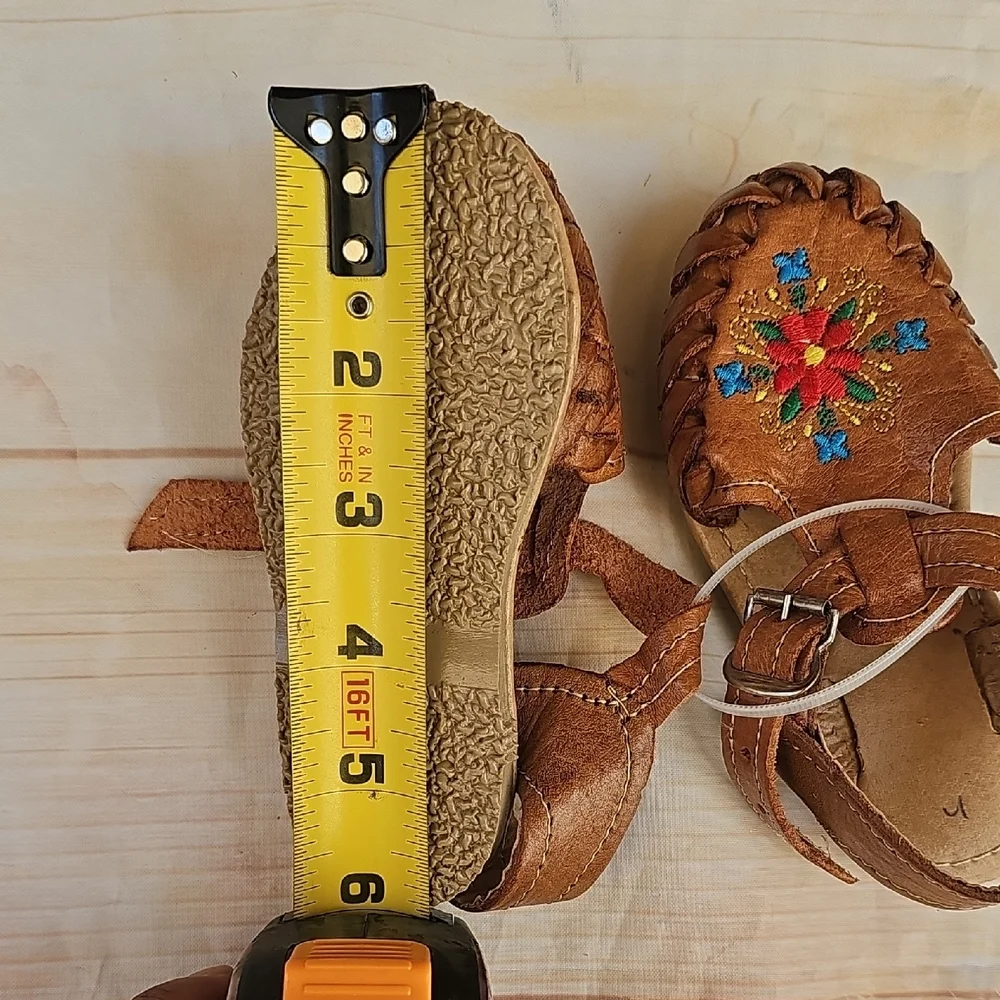 Brown and Red Moccasins with Beadwork and Fringe